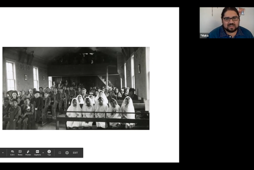 Maka Akan Najin Black Elk (upper right corner) shows an image of a Catholic boarding school for Indigenous children during a panel discussion on Oct. 31 hosted by the Catholic Mobilizing Network. At such boarding schools, Black Elk said, Indigenous childr