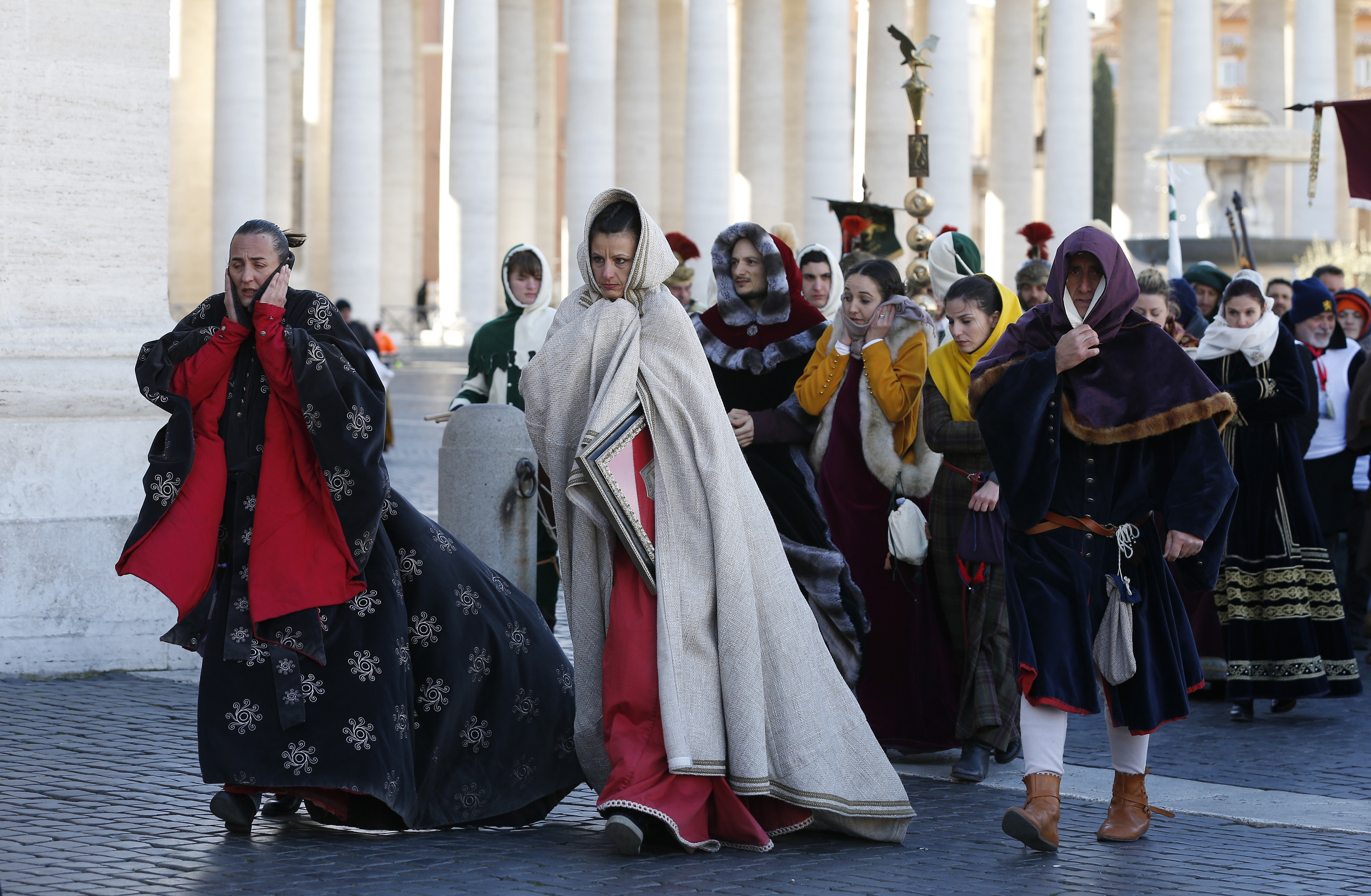 People in traditional attire endure cold weather during the annual parade marking the feast of the Epiphany in St. Peter's Square at the Vatican Jan. 6, 2017. (CNS photo/Paul Haring)