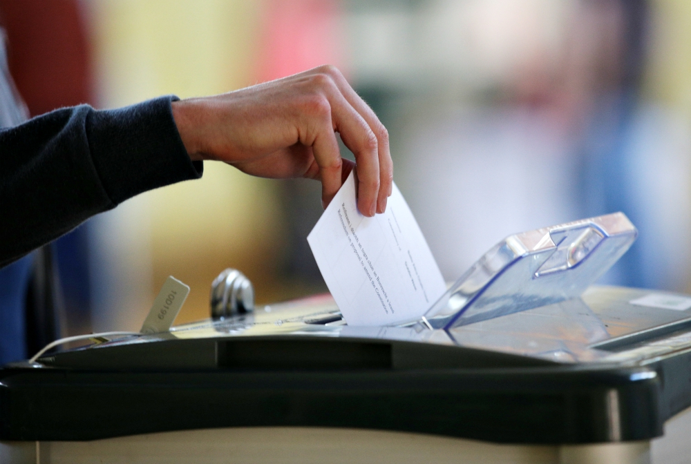 A voter casts his ballot May 25 in Dublin as Ireland holds a referendum on its law on abortion. (CNS/Reuters/Max Rossi)