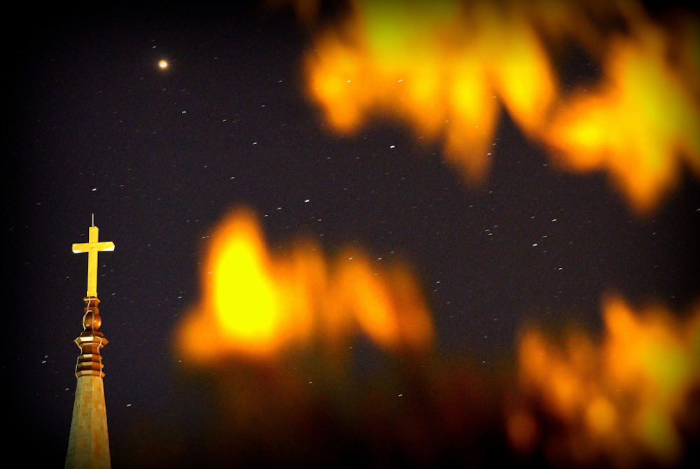 The steeple of St. Mary Catholic Church in Menasha, Wisconsin, is seen below a shining Mars Sept. 6, 2018. (CNS/Brad Birkholz)