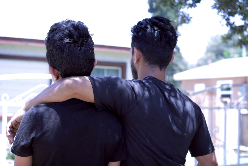 "Carlos" and "Enrique" pose for a photo June 12 in Riverside, Calif. The father and son left Guatemala in 2018 because of police corruption and were separated for more than two months upon arrival to the United States. (CNS/Angelus News/Pilar Marrero)