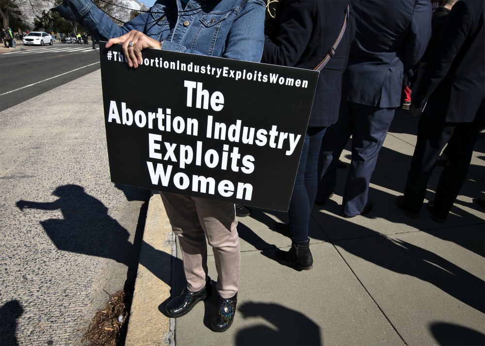 Pro-life activists gather outside the U.S. Supreme Court in Washington June 29. (CNS/Reuters/Carlos Barria)