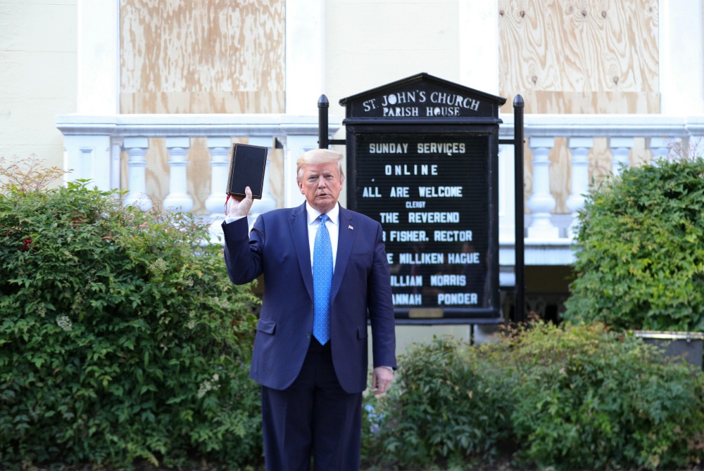 President Donald Trump holds a Bible as he stands in front of St. John's Episcopal Church in Washington June 1. (CNS/Reuters/Tom Brenner)