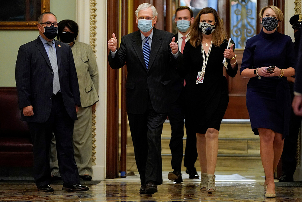 Senate Majority Leader Mitch McConnell, R-Ky., gives a thumbs up after the confirmation vote of Amy Coney Barrett to the Supreme Court on Capitol Hill Oct. 26, 2020, in Washington. They voted 52-48 to confirm President Donald Trump's nominee. (CNS/Reuters