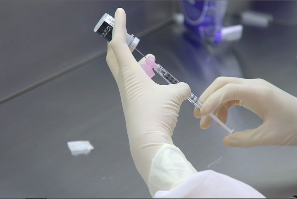 A pharmacist undergoes training in preparation for the distribution of the Pfizer coronavirus vaccine at a Mount Sinai Health System pharmacy in the Queens borough of New York City in this handout photo released Dec. 10. (CNS/Mount Sinai Health System via