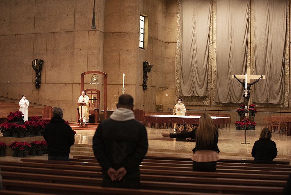 Archbishop José Gomez of Los Angeles, president of the U.S. Conference of Catholic Bishops, celebrates Christmas Eve Mass Dec. 24, 2020, at the Cathedral of Our Lady of the Angels in Los Angeles. (CNS/Victor Alemán, Angelus News)