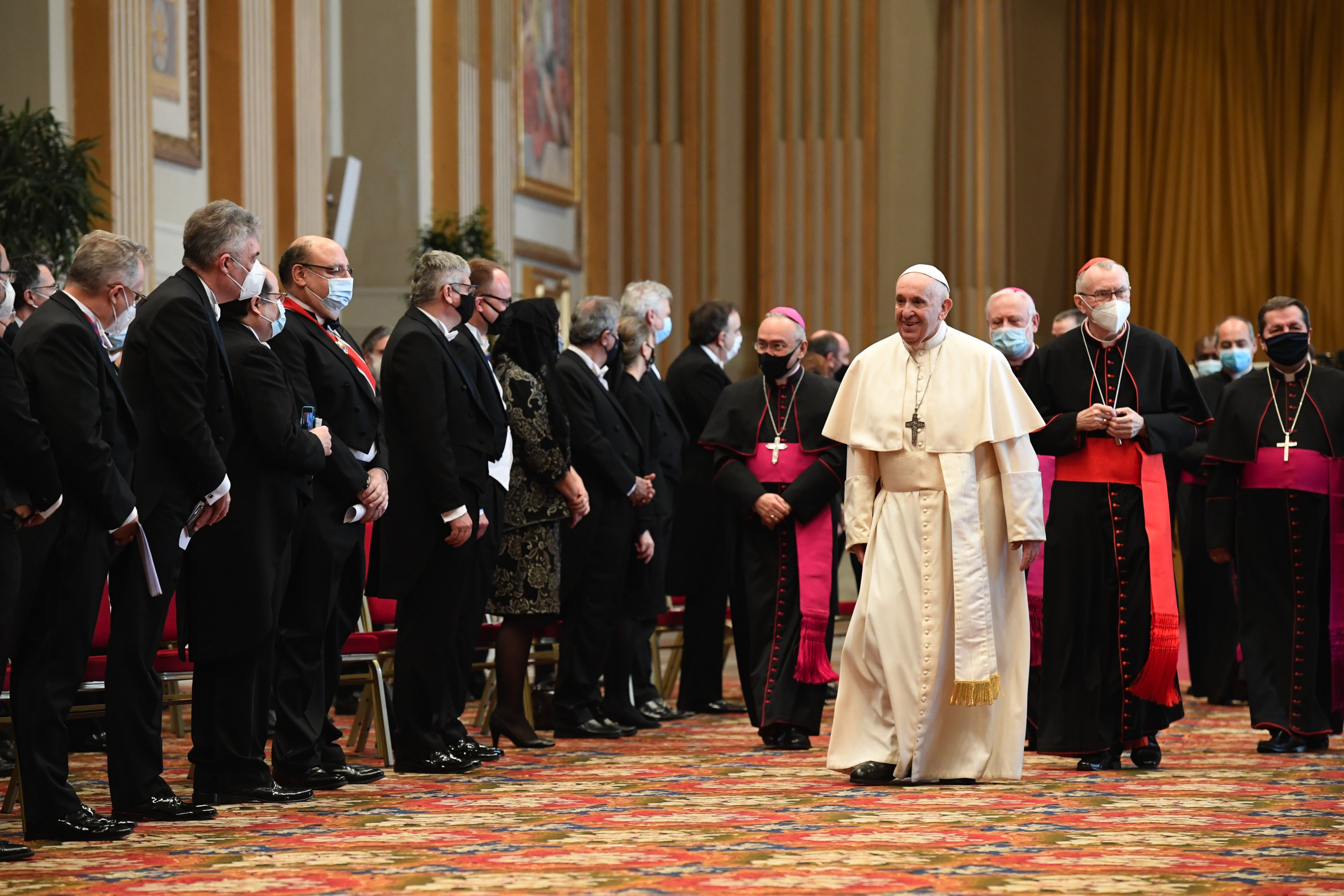 Pope Francis walks near diplomats accredited to the Holy See during an audience in the Hall of Blessings at the Vatican Feb. 8, 2021. (CNS/Vatican Media)