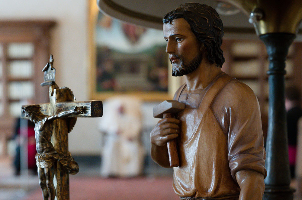 A statue of St. Joseph is seen as Pope Francis leads his general audience in the library of the Apostolic Palace at the Vatican March 24. (CNS/Vatican Media)