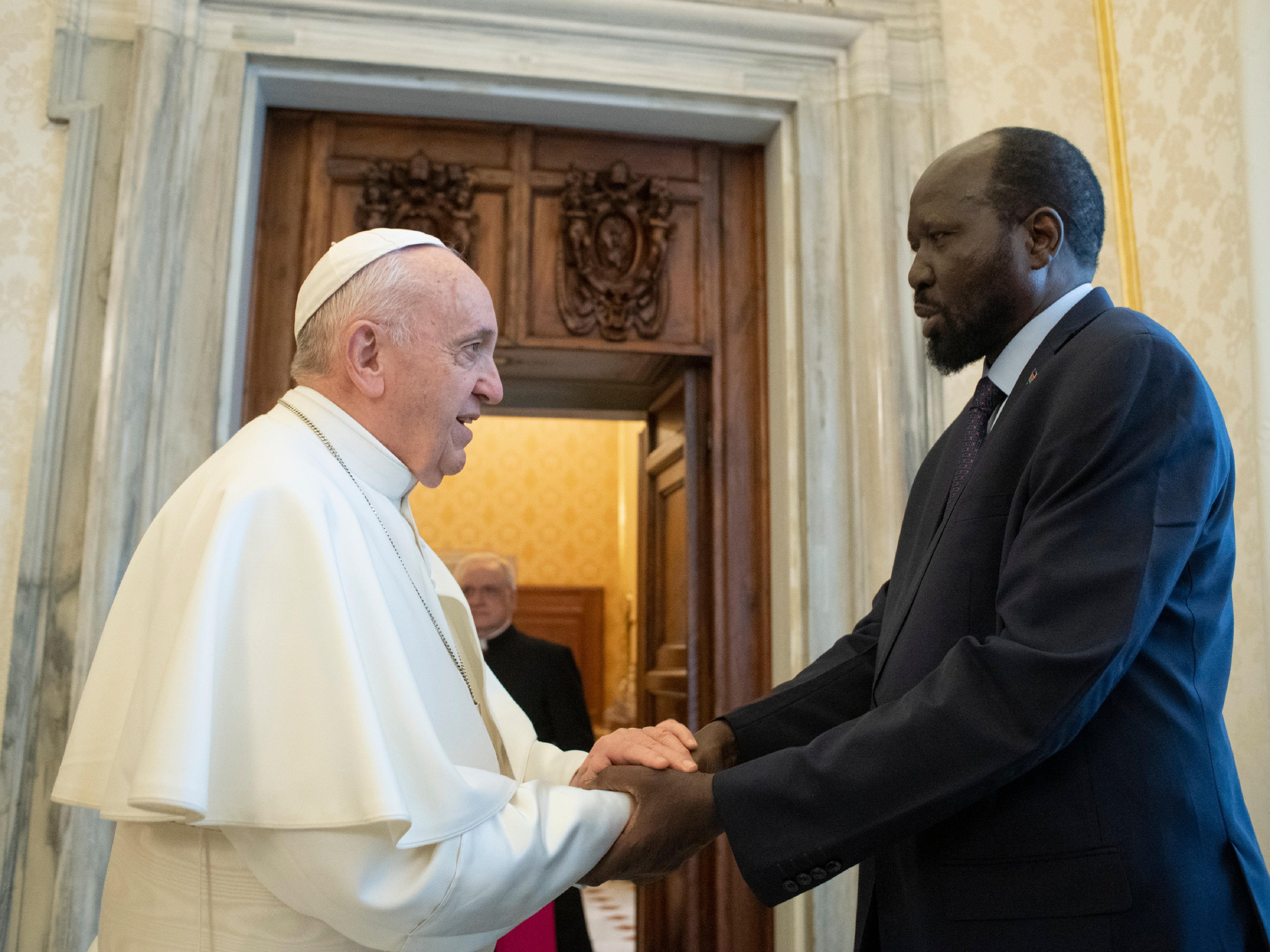 Pope Francis shakes hands with South Sudanese President Salva Kiir during a private audience at the Vatican March 16, 2019. (CNS/Vatican Media)