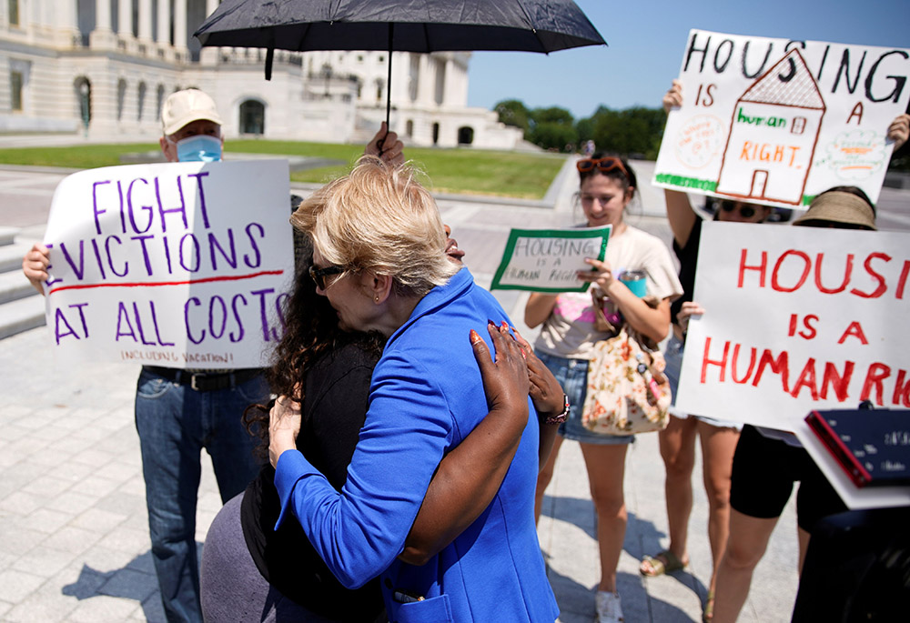 U.S. Rep. Cori Bush and U.S. Sen. Elizabeth Warren embrace July 31, 2021, in front of the U.S. Capitol in Washington. Bush spent the night there to highlight the midnight expiration of a pandemic-related federal moratorium on residential evictions. (CNS)