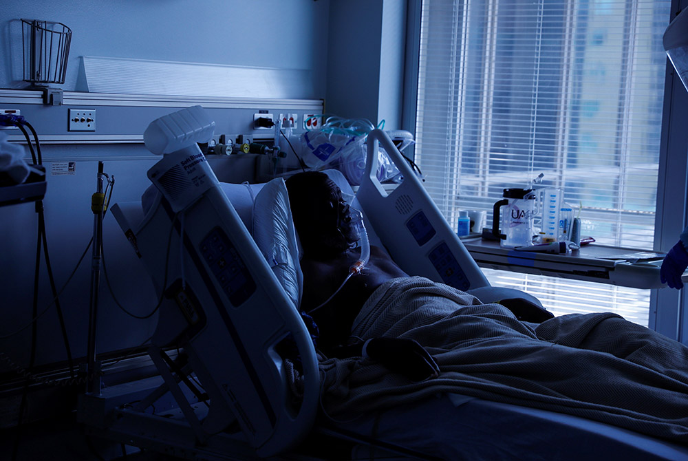 A COVID-19 patient in Little Rock, Arkansas, lays in his isolation room in the COVID-19 unit Aug. 16 at the University of Arkansas for Medical Sciences. (CNS/Reuters/Shannon Stapleton)