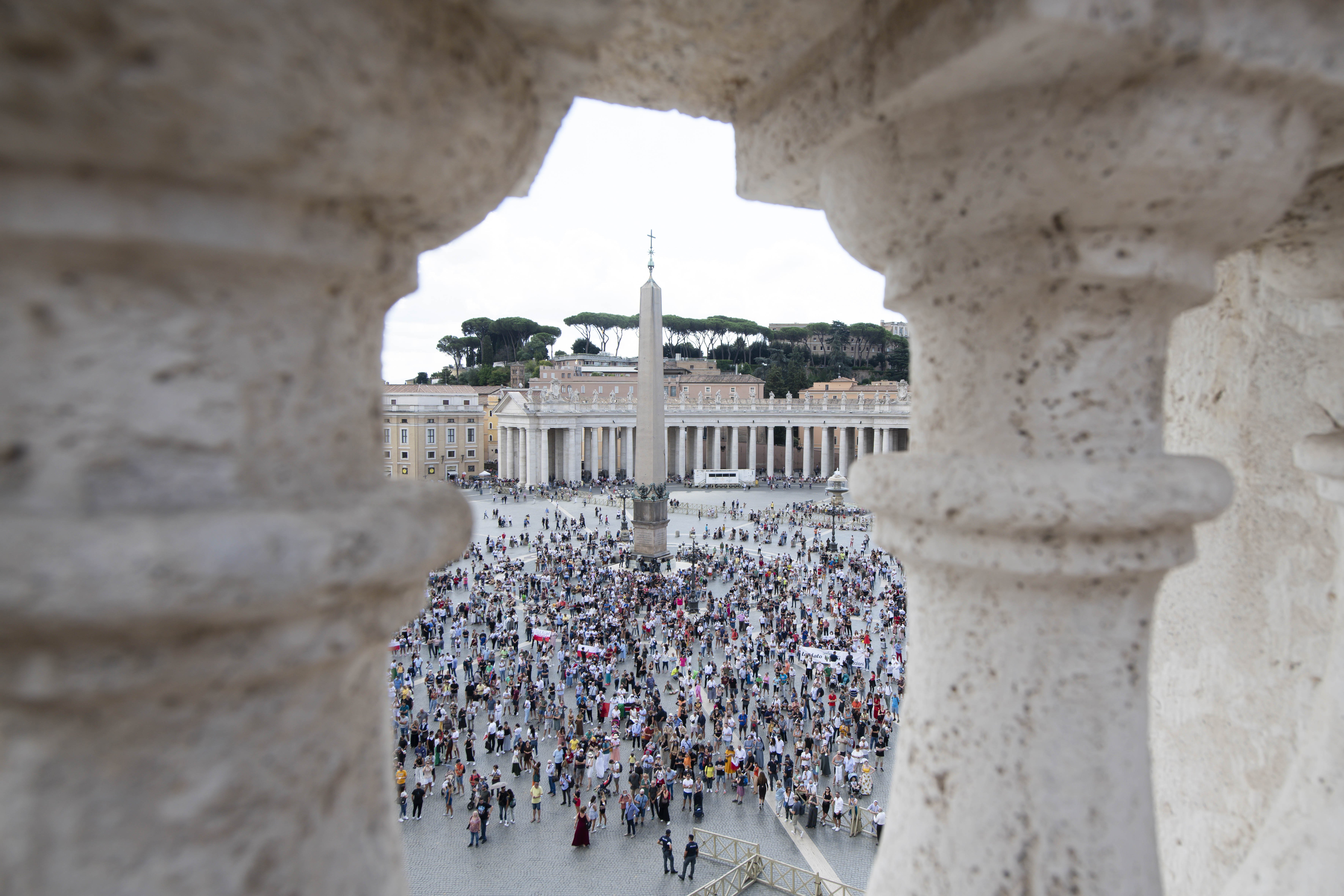 People in St. Peter's Square attend Pope Francis' recitation of the Angelus from the window of his studio overlooking the square at the Vatican Sept. 19, 2021. (CNS photo/Vatican Media)