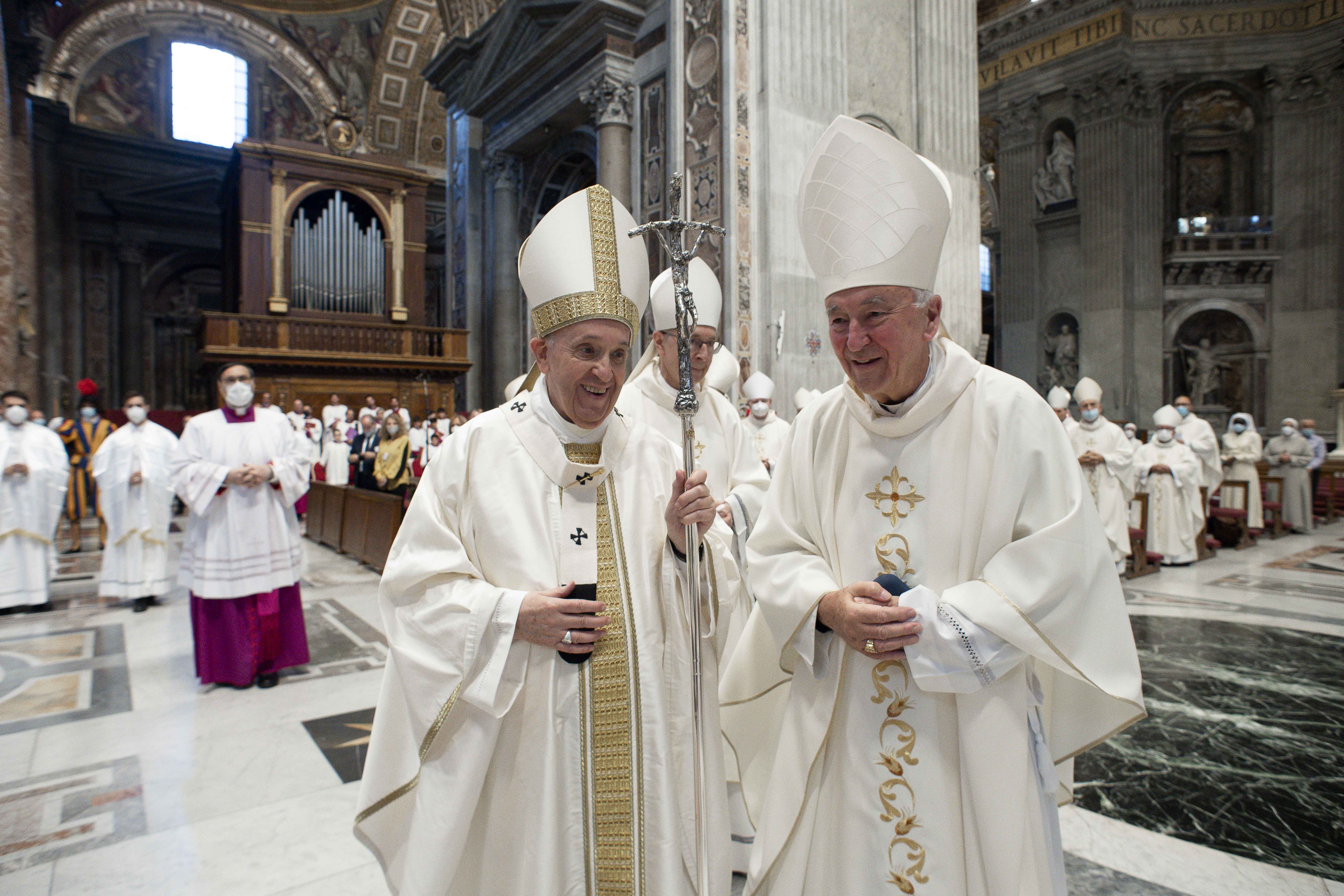 Pope Francis and Cardinal Vincent Nichols of Westminster, vice president of the Council of European Bishops' Conferences, smile during the opening Mass of the plenary assembly of the Council of European Bishops' Conferences in St. Peter's Basilica at the 