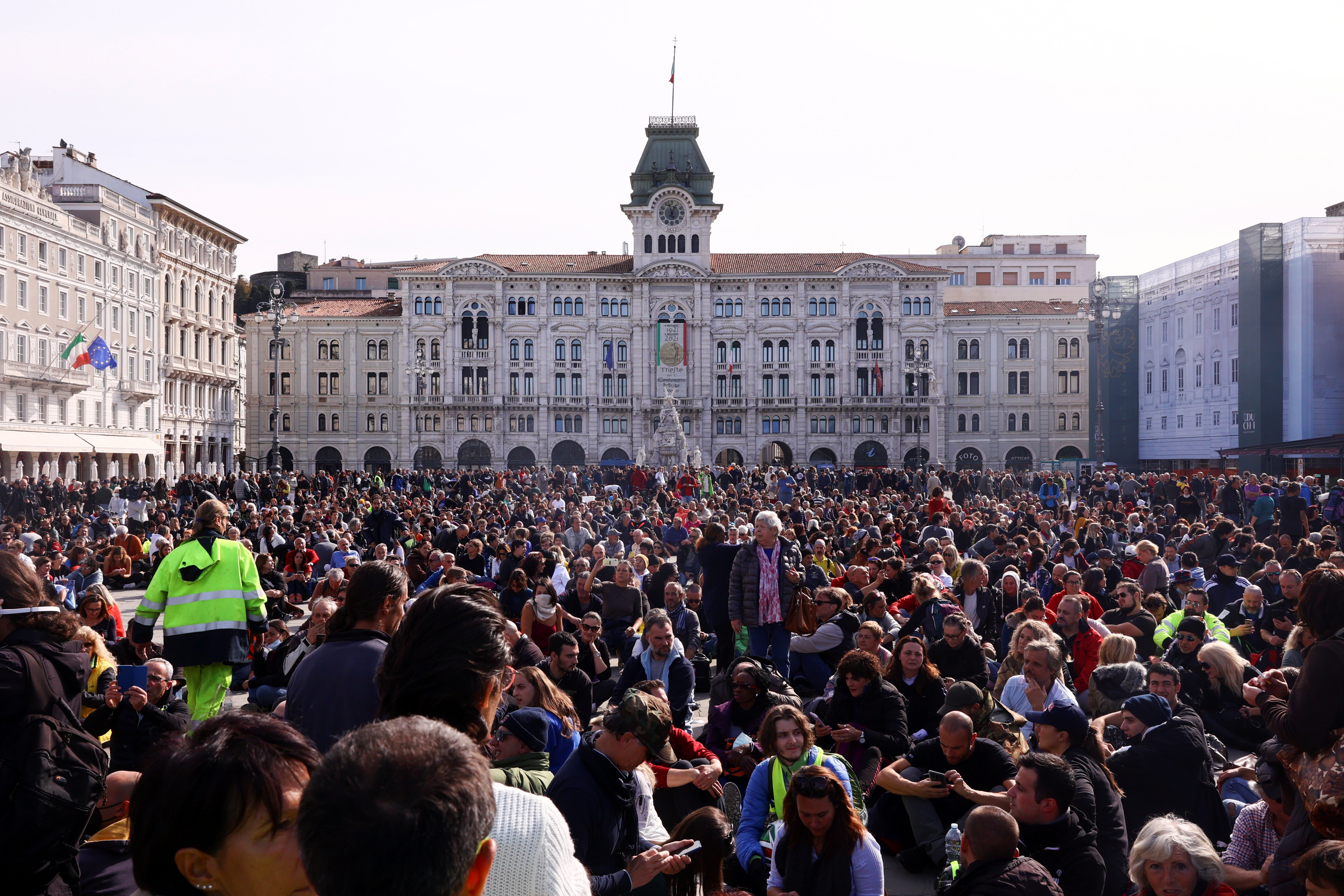 People protest against the implementation of the coronavirus disease "green pass" in the workplace in demonstration at the Unity of Italy Square (Piazza Unita d'Italia) Oct. 18, 2021. (CNS photo/Borut Zivulovic, Reuters)