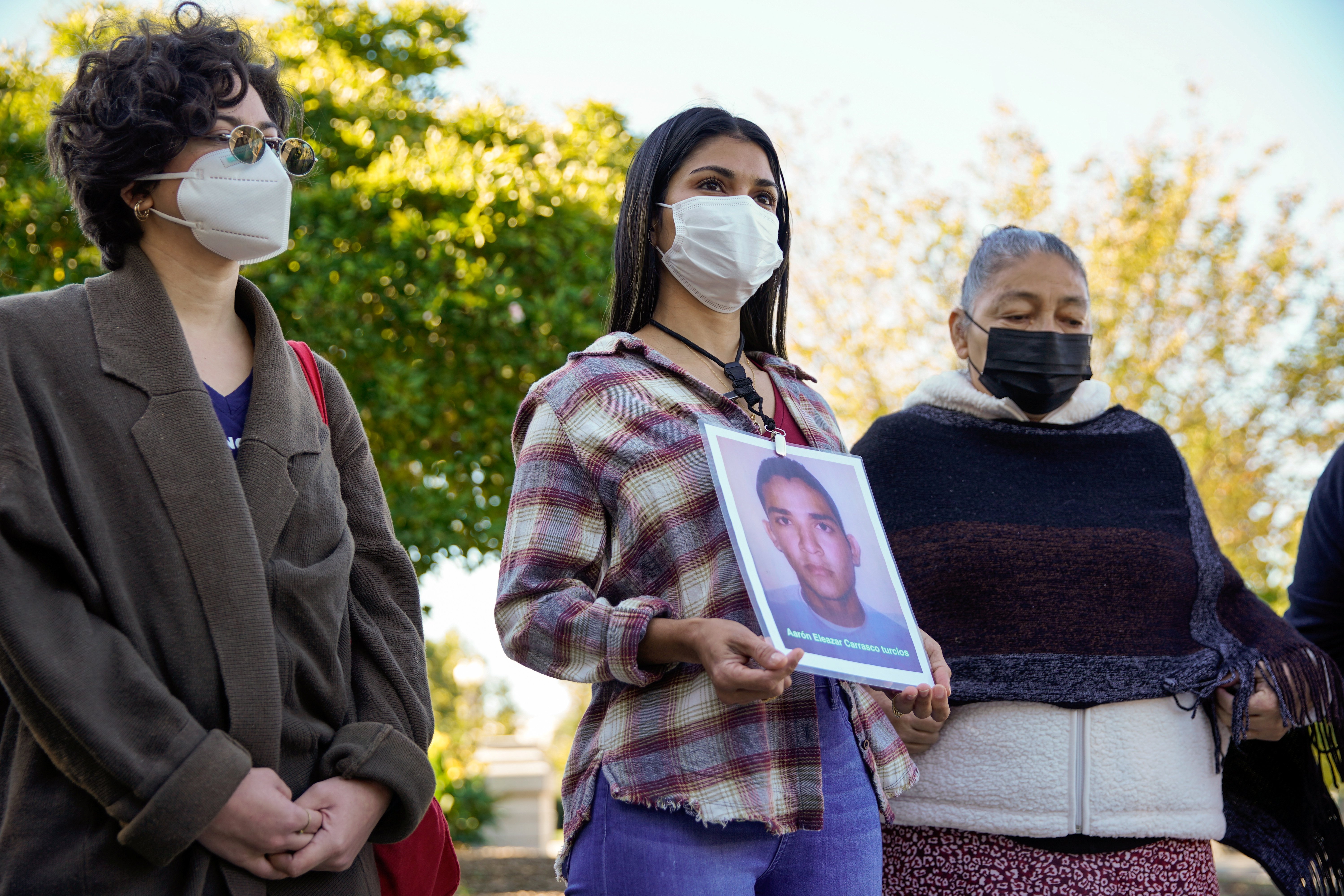 Karen Morales of Honduras talks about her brother, Aaron Eleazar Carrasco Turcios, who went missing nine years ago in Mexico, while standing with other women with the Caravan of Mothers of Disappeared Migrants on Capitol Hill in Washington Oct. 19, 2021. 