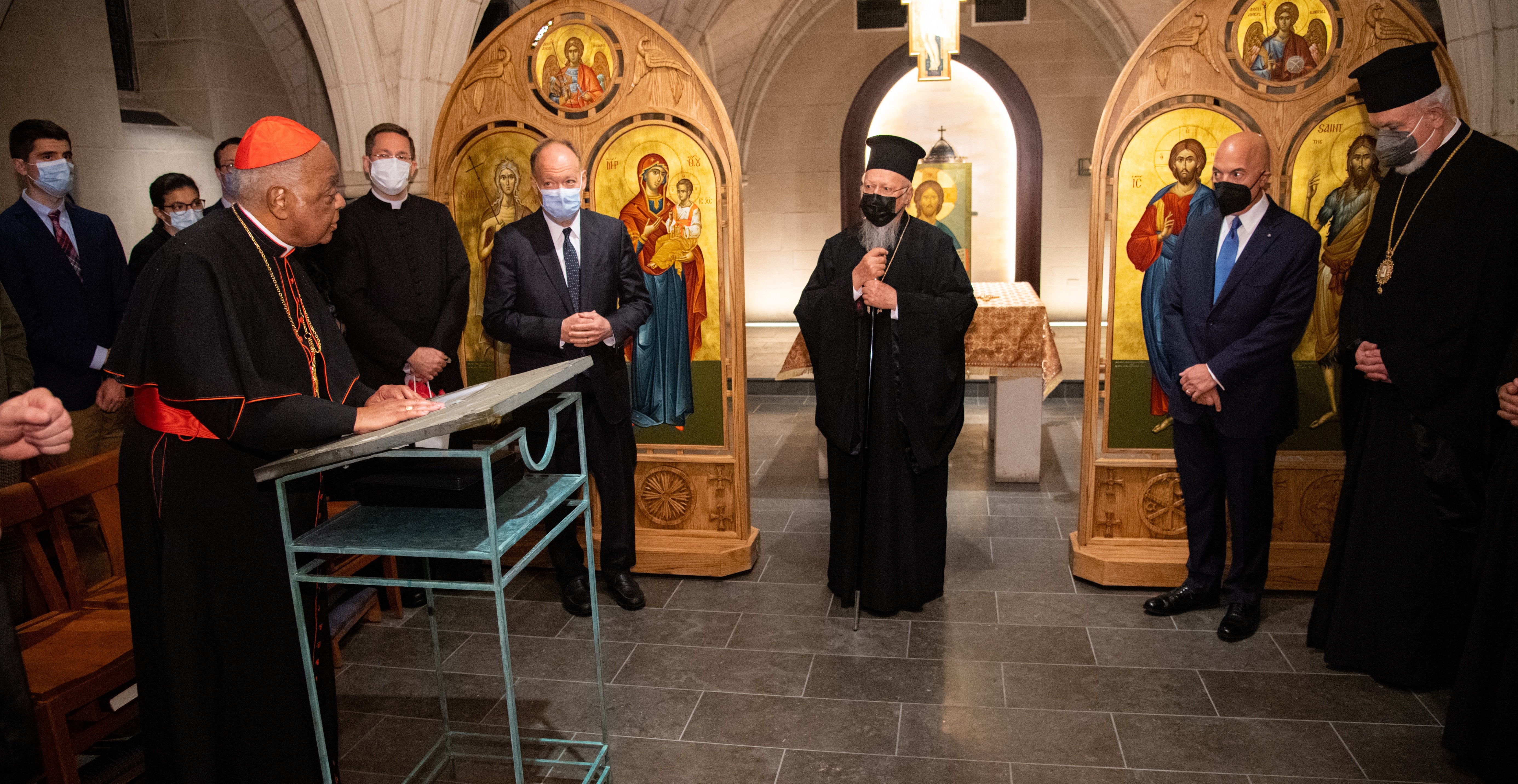 Washington Cardinal Wilton D. Gregory, left, greets Ecumenical Patriarch Bartholomew of Constantinople, center, during the Orthodox spiritual leader's Oct. 25, 2021, visit to Georgetown University's Copley Crypt Chapel. (CNS photo/Phil Humnicky, Georgetow