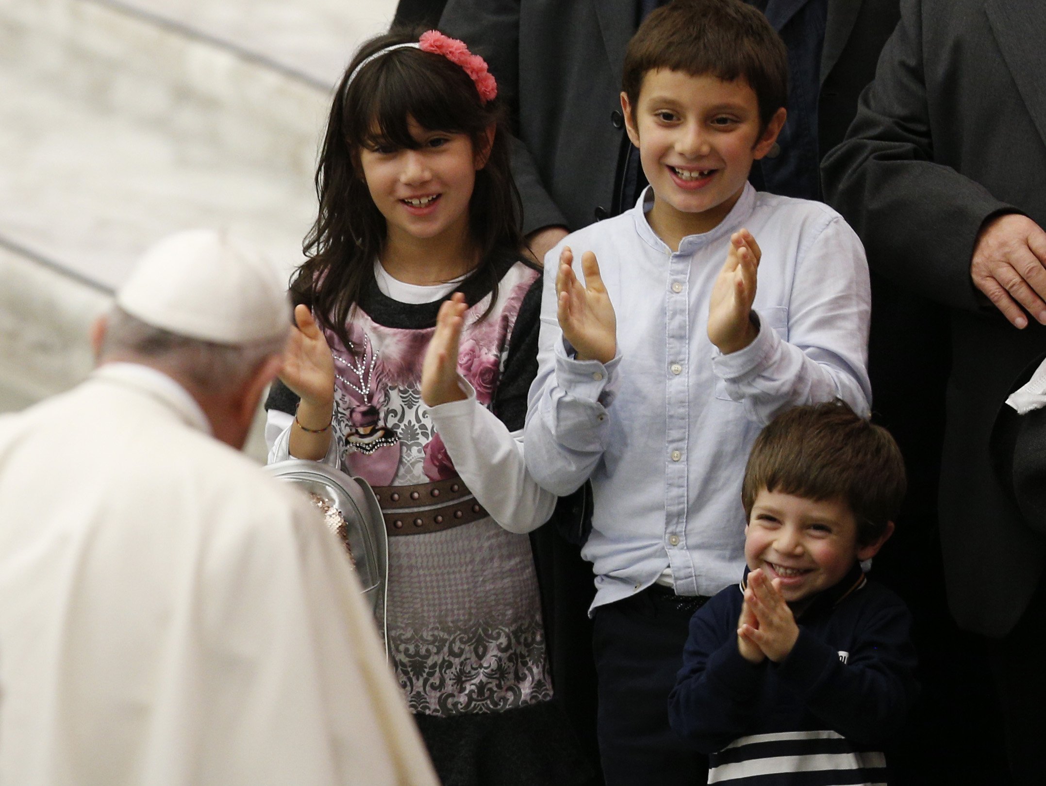 Children applaud as they meet Pope Francis during his general audience in the Paul VI hall at the Vatican Oct. 27, 2021. (CNS photo/Paul Haring)