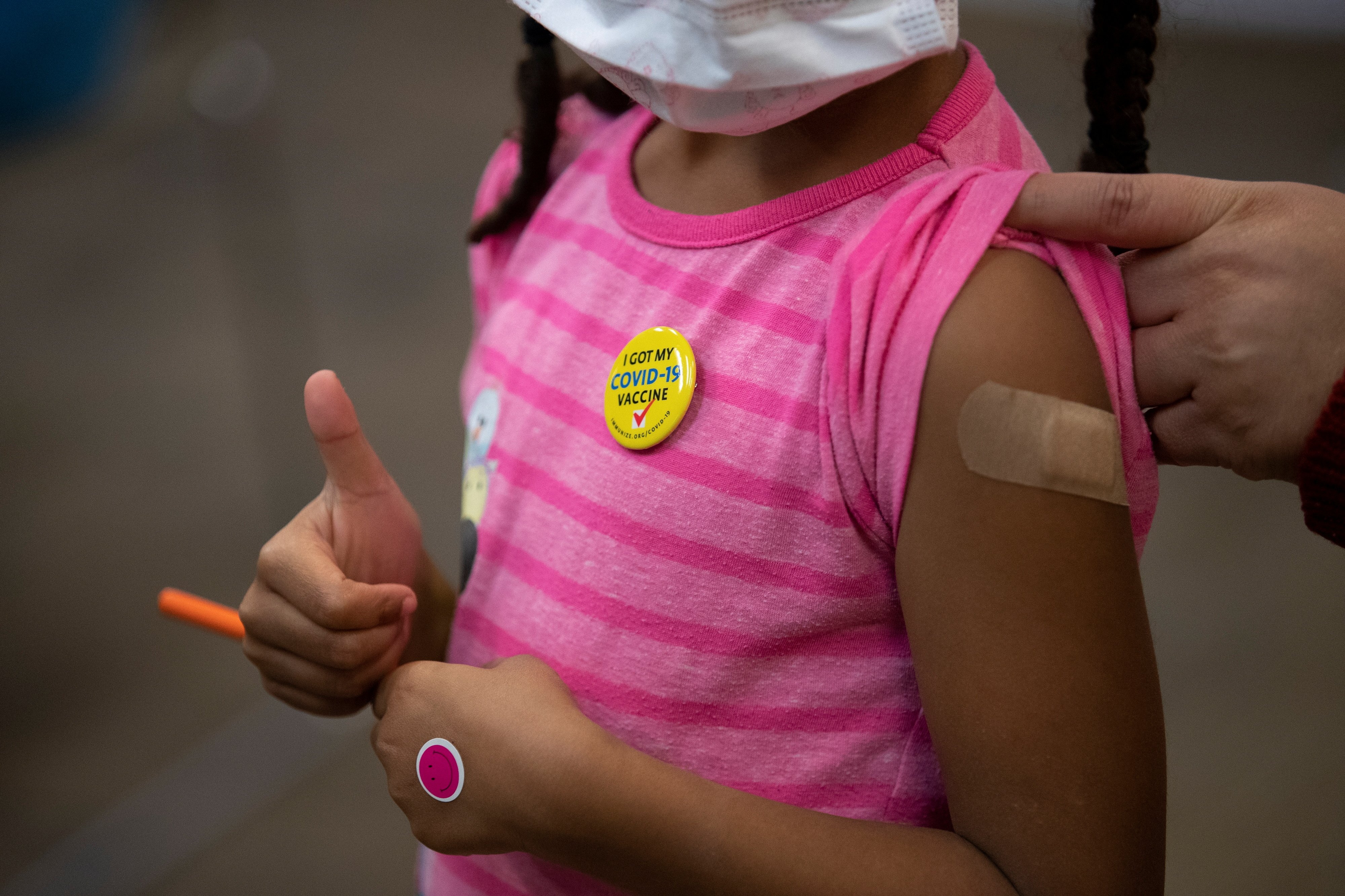 Josclyn Ledisma, 5, gives a thumbs up after receiving her first dose of the COVID-19 vaccine inside Mary's Center in Washington Nov. 3, 2021. (CNS photo/Tom Brenner, Reuters)