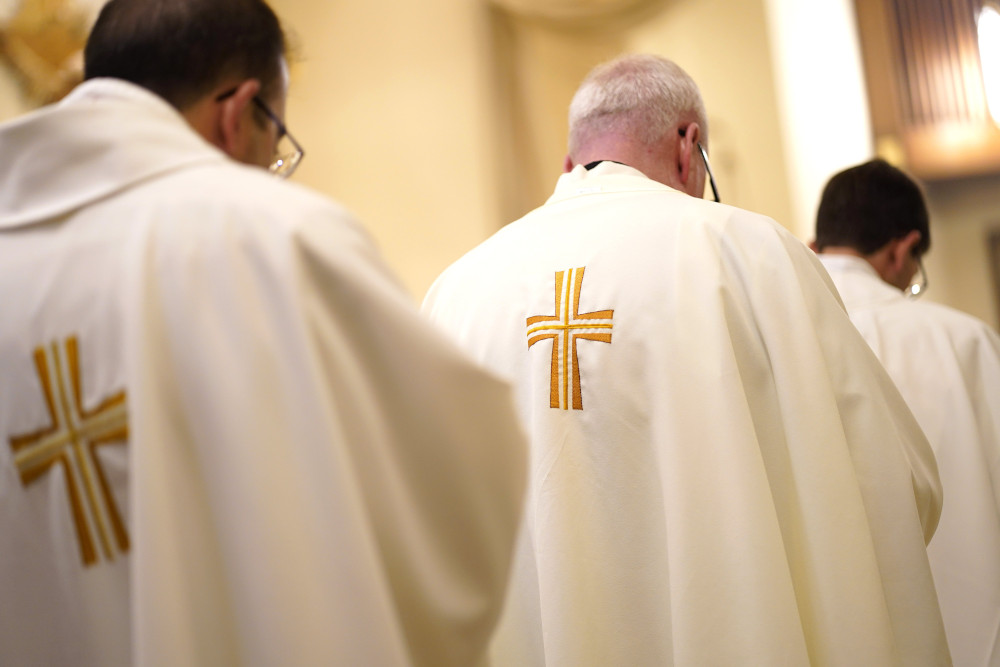 Priests are seen during a special Mass for vocations at Cure of Ars Church in Merrick, N.Y., Aug. 4, 2022, the feast of St. John Vianney, patron of parish priests. (CNS photo/Gregory A. Shemitz)