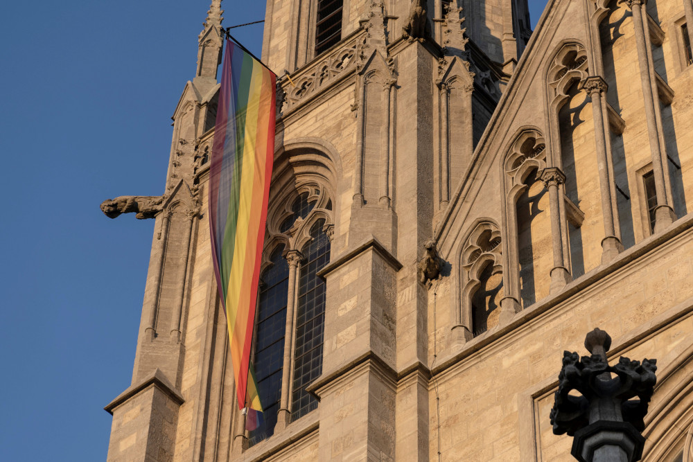 A LGBTQ flag hangs on St. Paul's Church in Munich 13, 2022. (CNS photo/Lukas Barth, Reuters)