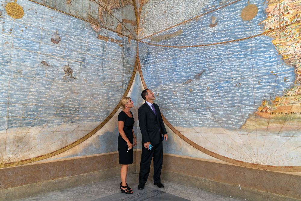 Robin Martin and Greg Asner admiring the hemispheres maps at Terza Loggia inside the Apostolic Palace in Vatican City (Courtesy of Lorenzo Magistrato)