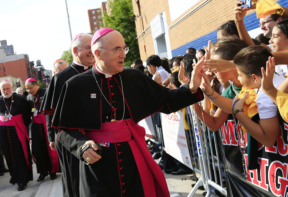 Archbishop Carlo Maria Viganò, then-apostolic nuncio to the U.S., greets children during Pope Francis' visit to Our Lady Queen of Angels School in East Harlem, New York, in this Sept. 25, 2015, file photo.  (CNS/The New York Times, pool/Eric Thayer)