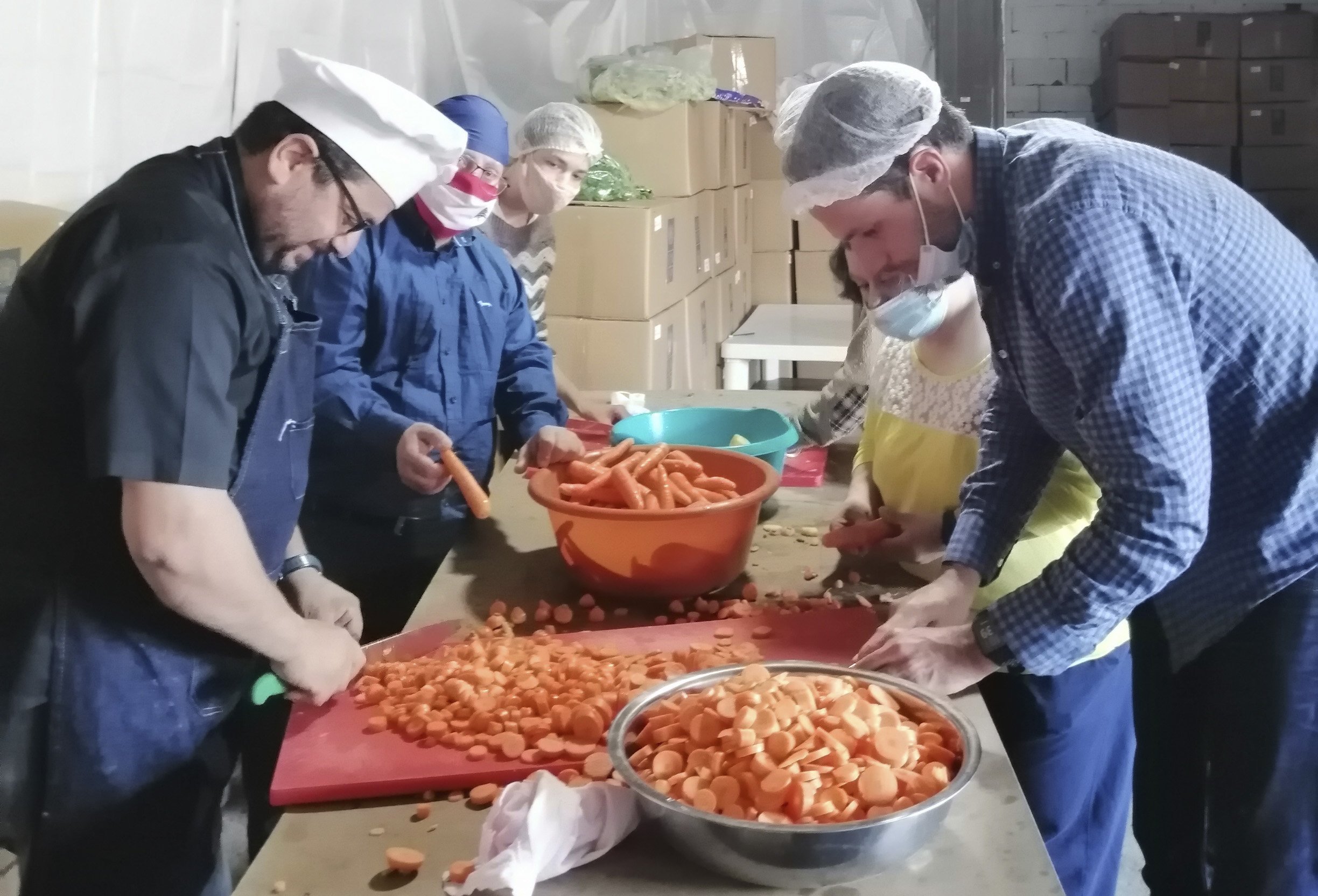 Maronite Father Hani Tawk and a team of volunteers prepare to cook meals for the needy at Mary's Kitchen in the blast-stricken neighborhood of Karintina in Beirut Nov. 24, 2020. (CNS photo/Doreen Abi Raad)