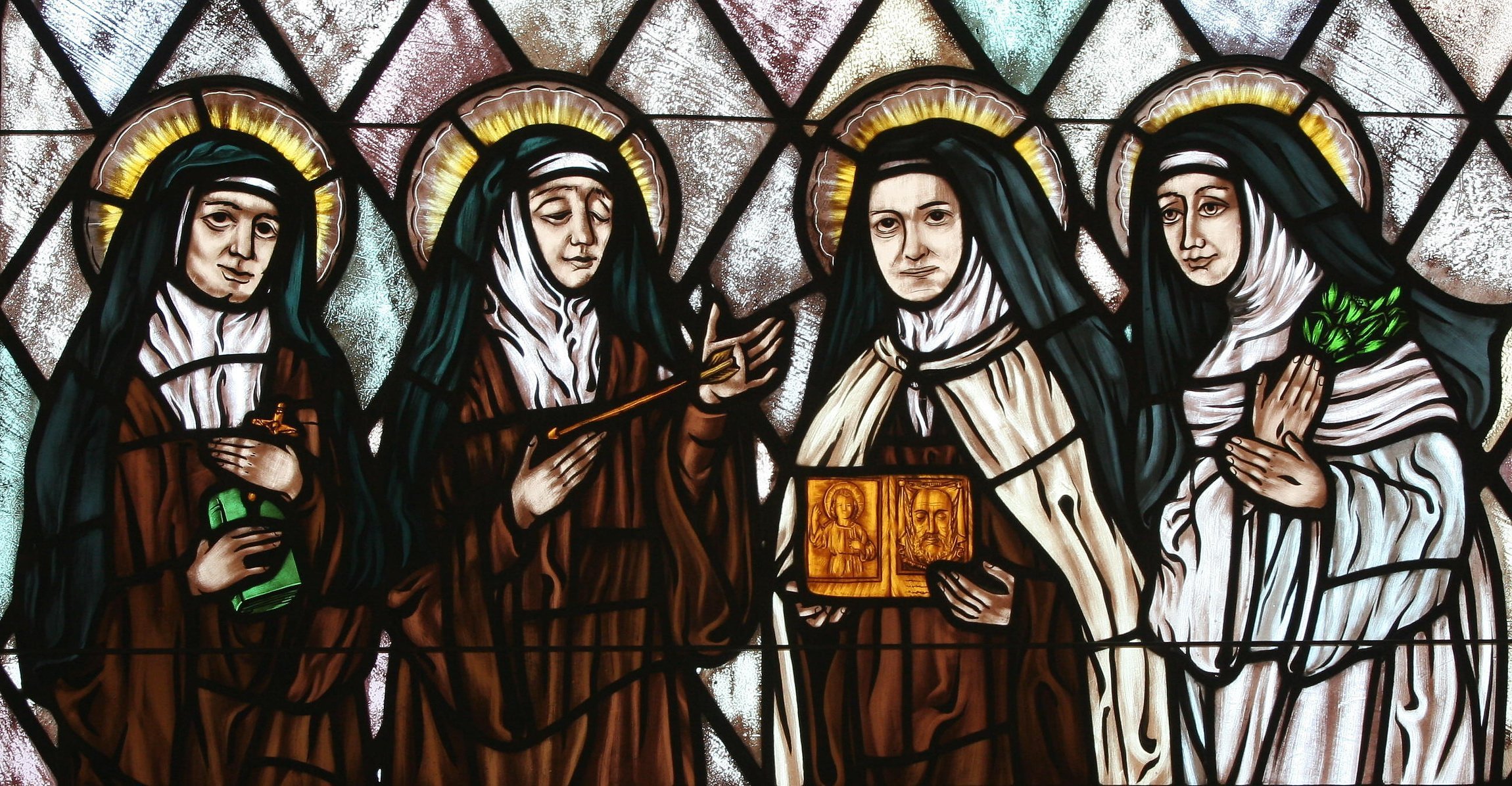 Sts. Edith Stein, Teresa of Ávila, Therese of Lisieux and Catherine of Siena are represented in stained glass at St. Thérèse of Lisieux Church in Montauk, N.Y. (CNS photo/Gregory A. Shemitz, Long Island Catholic)