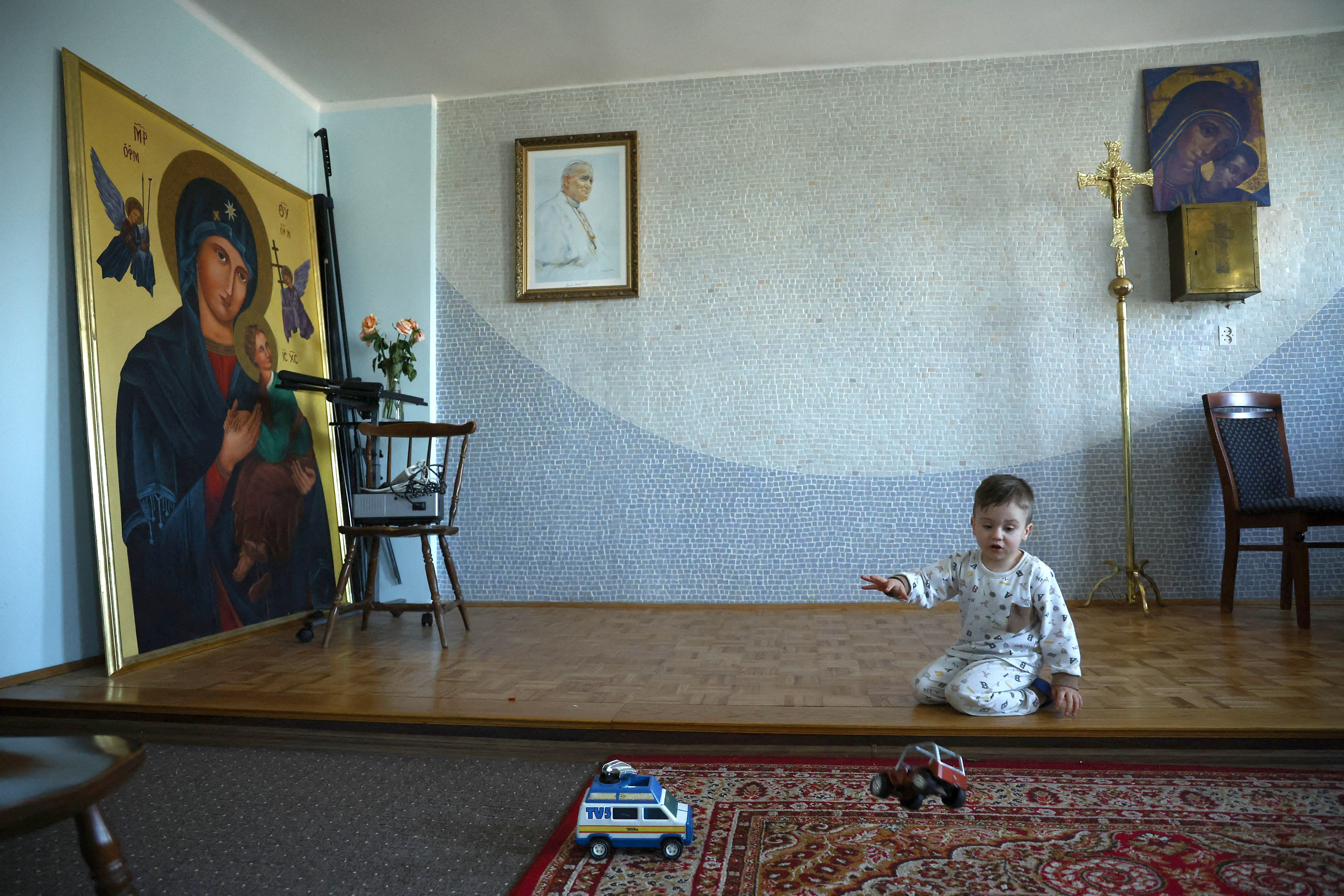 A Ukrainian boy plays at the residence of Father Roman Karpowicz in Lubaczow, Poland, March 21, 2022. (CNS photo/Kacper Pempel, Reuters)