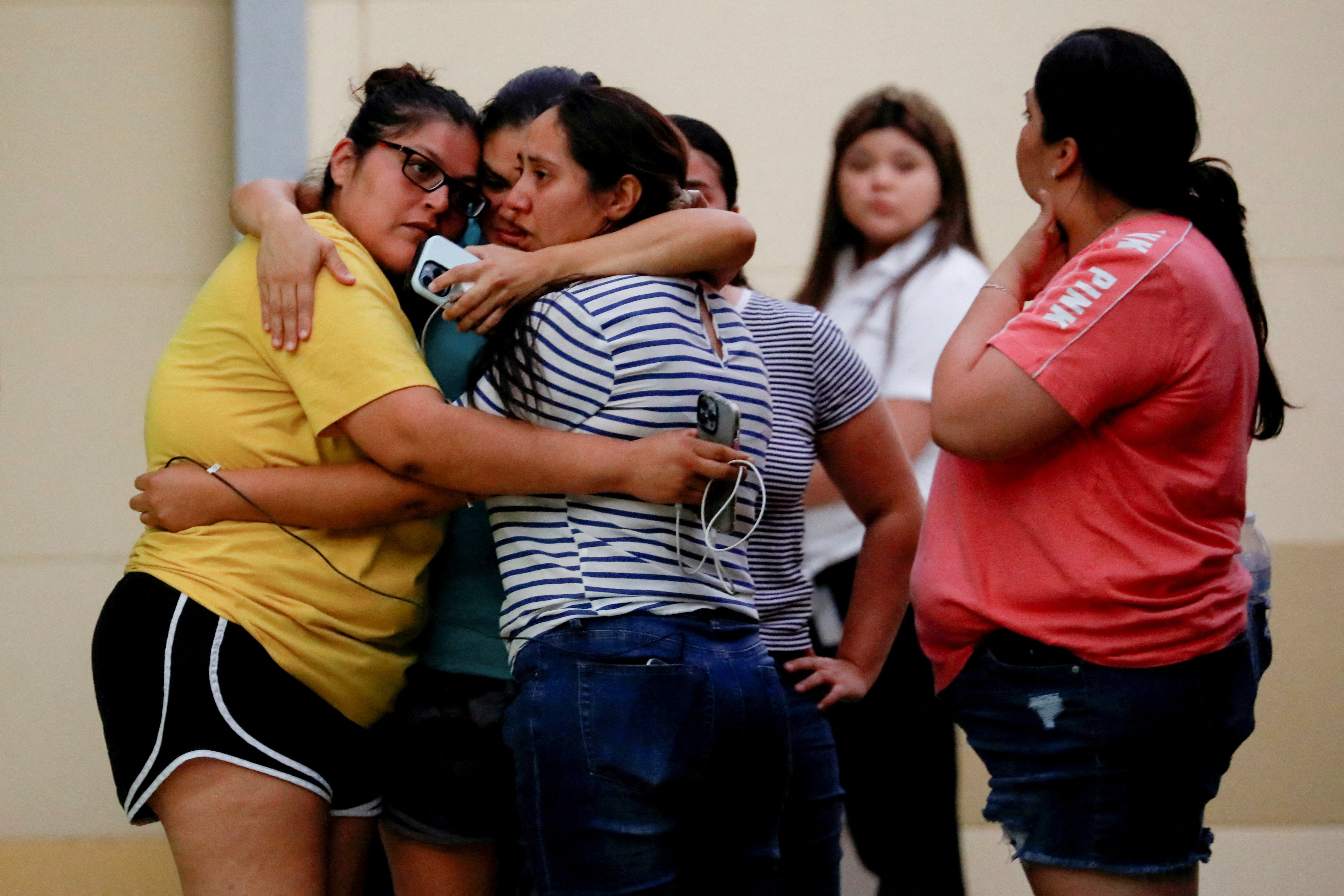 People react outside the SSGT Willie de Leon Civic Center, where students had been transported from Robb Elementary School after a shooting, in Uvalde, Texas, May 24, 2022. (CNS photo/Marco Bello, Reuters)