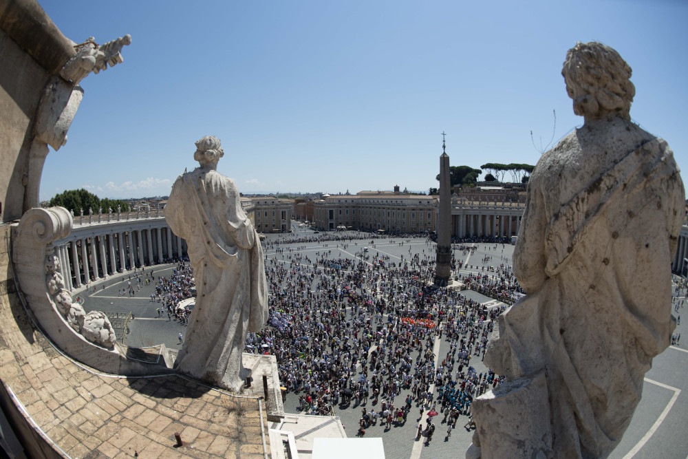 People in St. Peter's Square attend the Angelus led by Pope Francis from the window of his studio overlooking the square at the Vatican July 17. (CNS/Vatican Media)