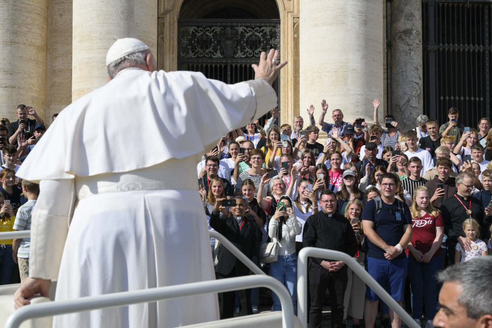 Pope Francis greets the crowd during his general audience in St. Peter's Square at the Vatican Oct. 12. (CNS/Vatican Media)