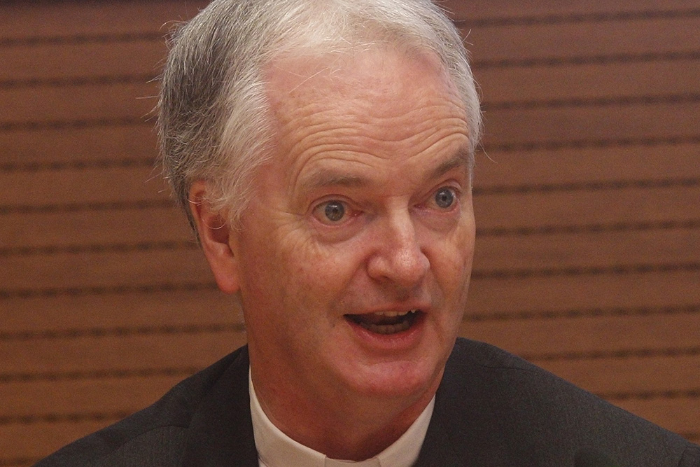 Bishop Paul Tighe speaks during a conference at the Vatican in 2019. (CNS/Robert Duncan)