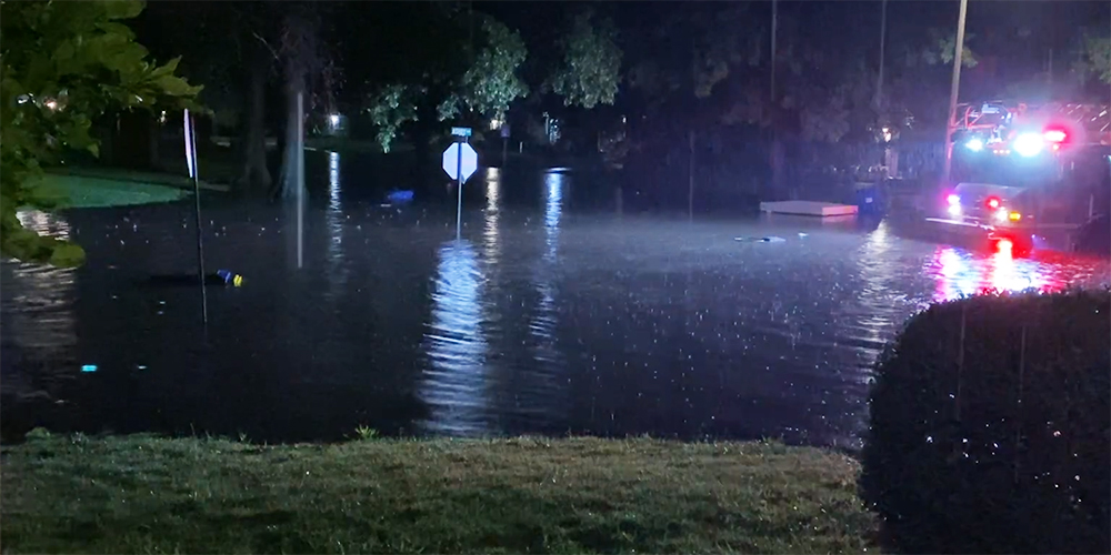 A fire truck in a street at night are pictured in this photo of Brent Jaimes' experience with flooding at his St. Louis area home. (Courtesy of Kathleen Corley)