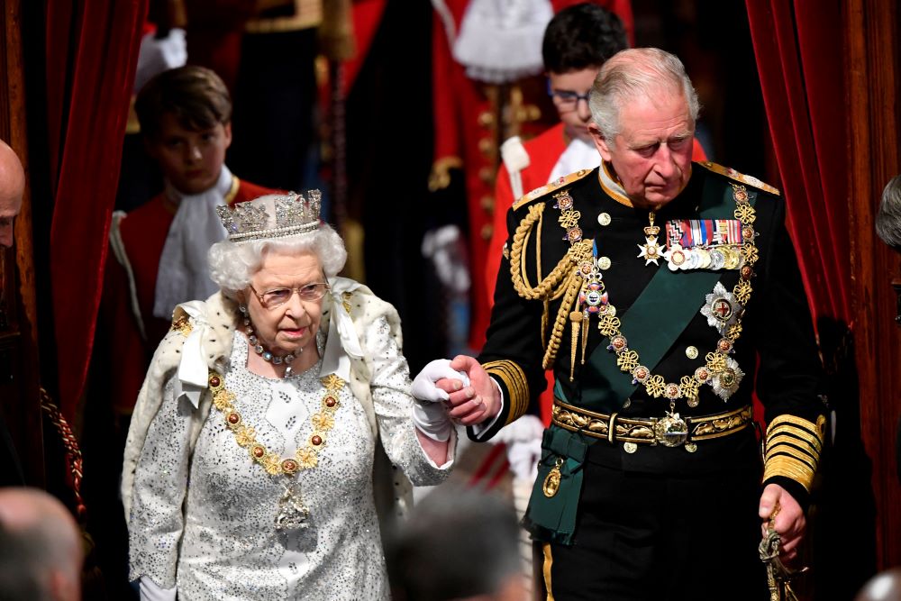 Britain's Queen Elizabeth II is seen arriving at the State Opening of Parliament with Prince Charles in London Oct. 14, 2019. The queen died Sept. 8, 2022, at the age of 96. Her successor, Charles III, will be crowned king on May 6. (CNS photo/Toby Melville, pool via Reuters)