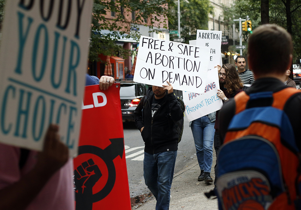 Supporters of legal abortion demonstrate outside the Basilica of St. Patrick's Old Cathedral Oct. 6, 2018, in New York City. The demonstration was timed to coincide with a monthly "Witness for Life" Mass celebrated inside the basilica and a subsequent rosary procession to a nearby Planned Parenthood center. (CNS/Gregory A. Shemitz)