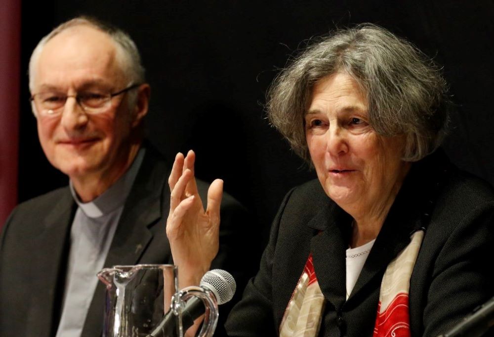 Phyllis Zagano speaks during a 2019 symposium on the history and future of women deacons at Fordham University. Looking on is Jesuit Fr. Bernard Pottier, a member of the Vatican's International Theological Commission.