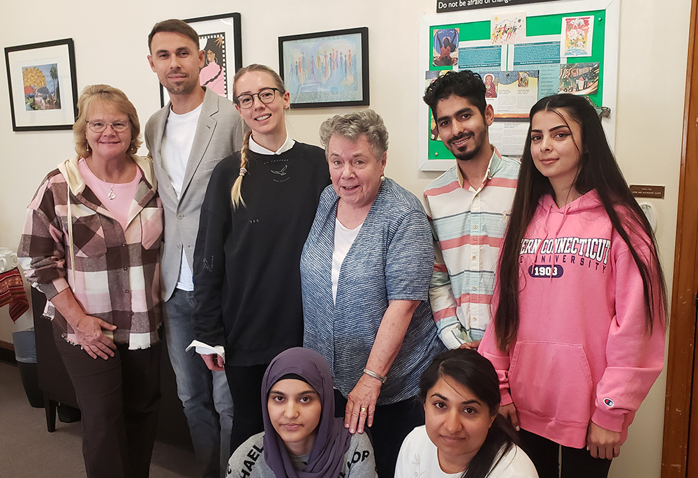 Sr. Karen Burke, left, and Sr. Annelle Fitzpatrick, center, are flanked by refugees the Sisters of St. Joseph of Brentwood in Brentwood, New York, have welcomed onto their campus. (GSR photo/Chris Herlinger)