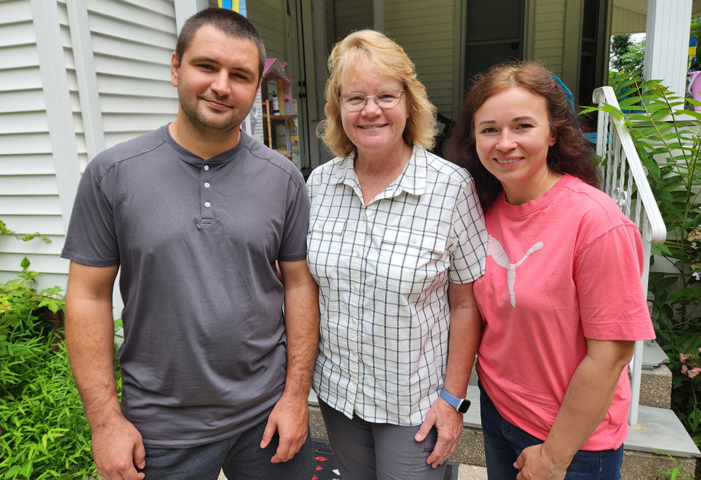 Igor Konovalova, Sr. Karen Burke and Igor's wife, Anna, outside the home where the couple lives with another Ukrainian family. (GSR photo/Chris Herlinger)