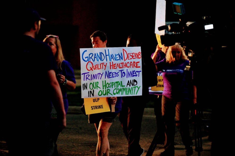 Small crowd. with someone holding a pro-union sign