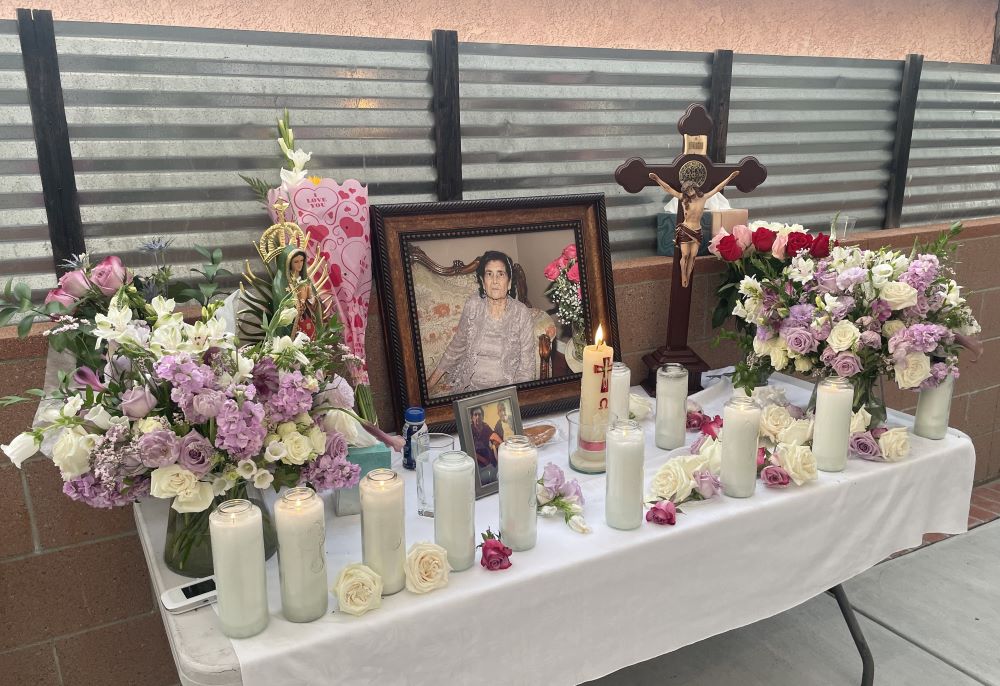 Candles, flowers and photo on table