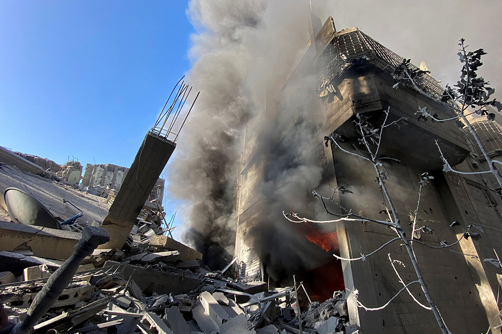 A house burns following an Israeli strike in Khan Younis, in the southern Gaza Strip, Nov. 7 amid the ongoing conflict between Israel and Palestinian Islamist group. (OSV News/Reuters/Bassam Masoud)