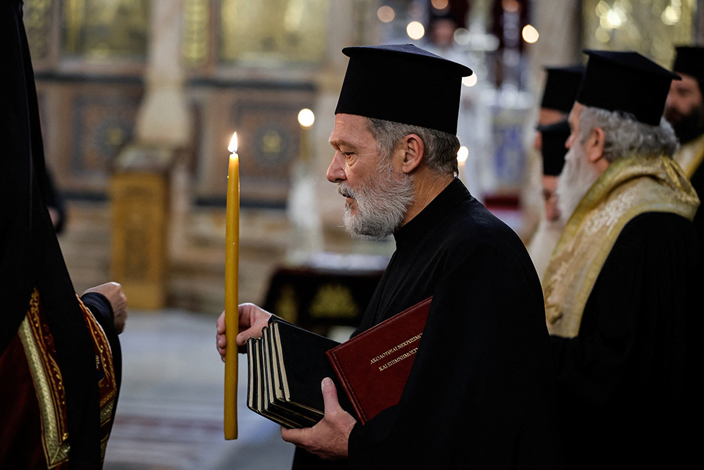 Worshippers take part in a special prayer for peace at the Church of the Holy Sepulcher in Jerusalem's Old City Oct. 22, amid the ongoing conflict between Israel and the Palestinian Islamist group Hamas. (OSV News/Reuters/Ammar Awad)