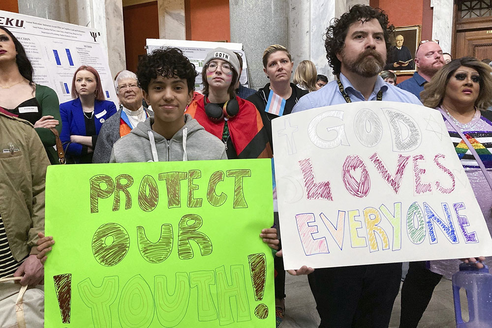 Transgender rights advocates gather near the Kentucky House chamber March 2 in Frankfort, Kentucky. On March 24, Gov. Andy Beshear vetoed a sweeping Republican measure aimed at regulating the lives of transgender youths. (AP/Bruce Schreiner, File)