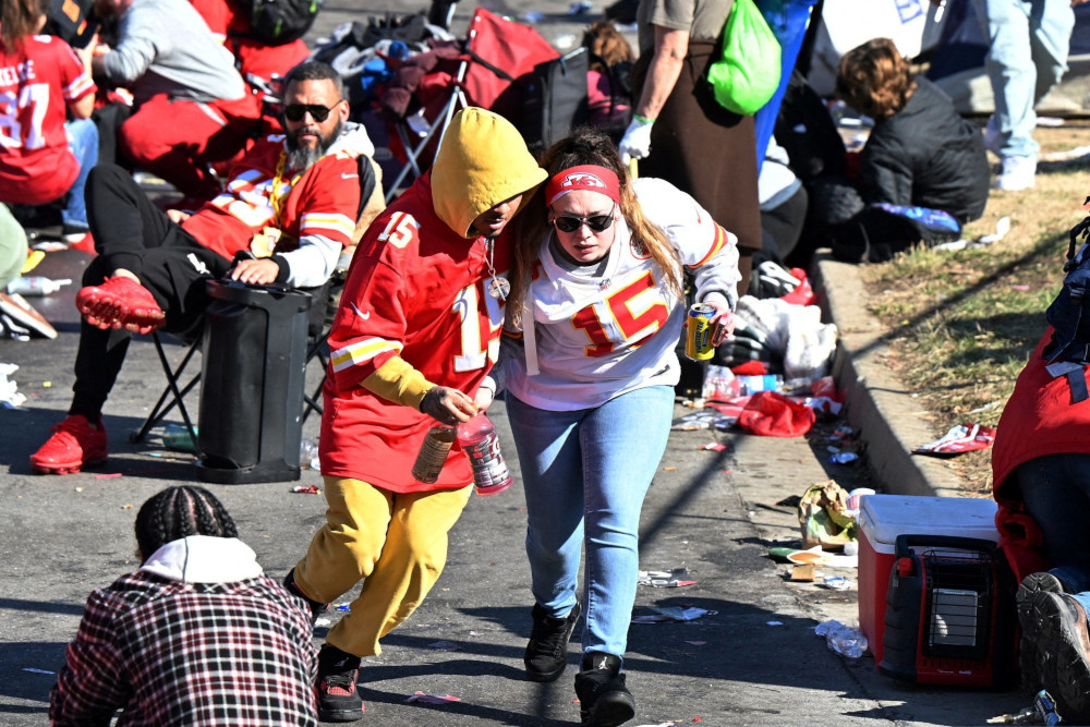 Fans leave the area after gun shots were fired in Kansas City, Mo., after the celebration of the Kansas City Chiefs winning Super Bowl LVIII. The shooting at the end of the parade left one dead and at least 15 injured, while sending terrified fans running for cover. (OSV News photo/Kirby Lee-USA TODAY Sports via Reuters)