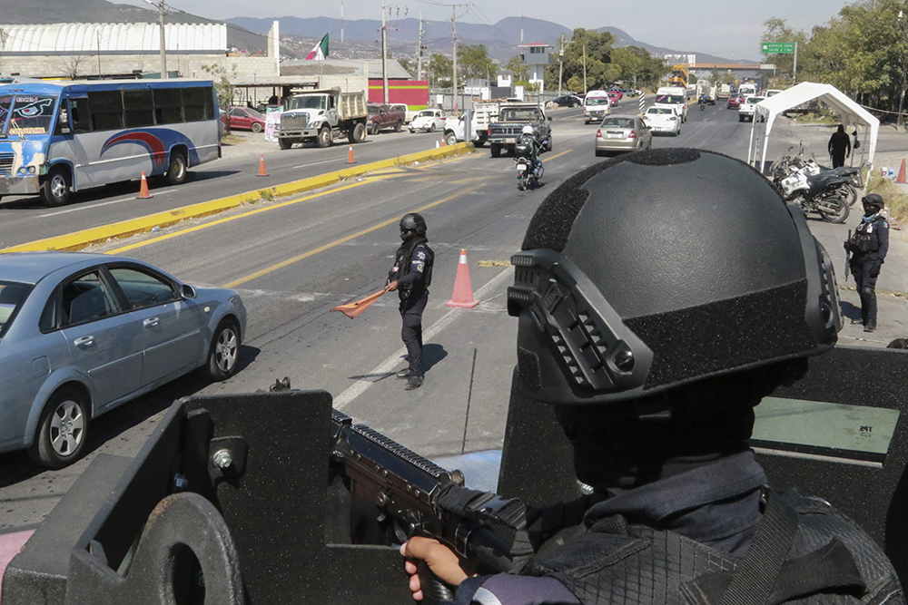 State police maintain a security checkpoint at the entrance of Chilpancingo, Mexico, Feb. 15, 2024. Four Roman Catholic bishops met with Mexican drug cartel bosses in a bid to negotiate a possible peace accord, according to the Bishop of Chilpancingo-Chilapa, José de Jesús González Hernández. (AP/Alejandrino Gonzalez)