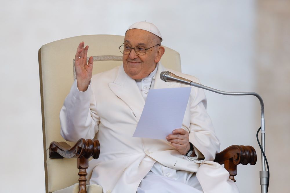 Pope Francis greets visitors while he makes brief remarks at the end of his weekly general audience in St. Peter's Square at the Vatican on March 6.