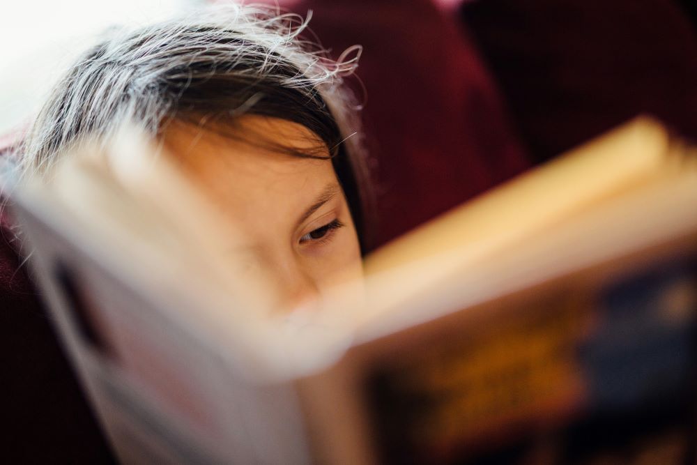 Child reading a book