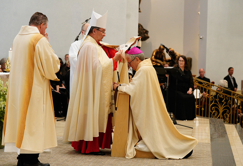 Cardinal Christophe Pierre, nuncio to the U.S., vests Las Vegas Archbishop George Leo Thomas with the Pallium during a Mass for elevating the Diocese of Las Vegas to an archdiocese at the Shrine of the Most Holy Redeemer Oct. 16, 2023, in Las Vegas. (OSV News/ Archdiocese of Las Vegas/Robin Jerstad)