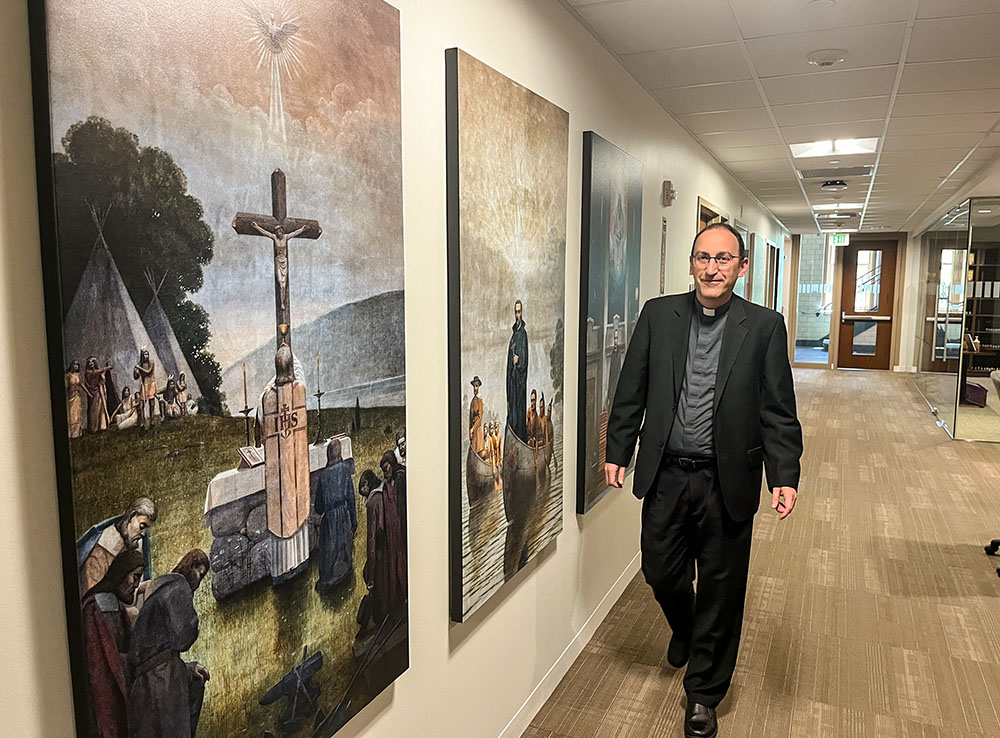 Fr. Jesús Folgado García, director of the documentary film "Diego de Pantoja, SJ: A Bridge Between China and the West," walks down a hallway at the Boston College Institute for Advanced Jesuit Studies. (Luis Donaldo Gonzalez)